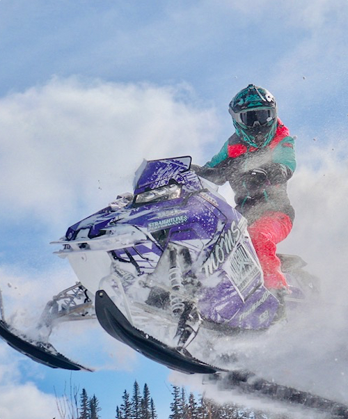 Daniele Boucher riding snowmobile